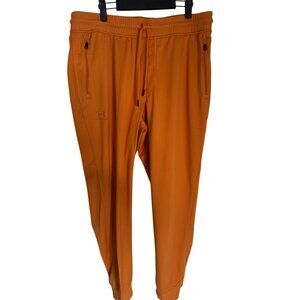 NWT Under Armour XL Mens Jogger Pants Orange Loose Fit 100% Polyester